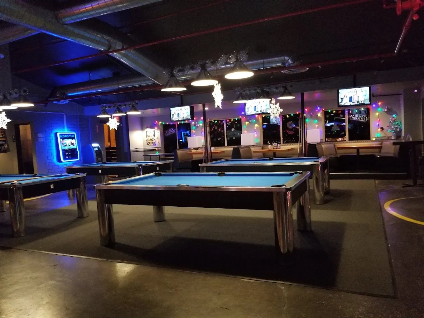 The pool room at Rack in Old Town Scottsdale, lit for a night of billiards